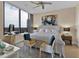 Inviting bedroom with large window, neutral color scheme, and comfortable seating area at 2828 Peachtree Nw Rd # 1402, Atlanta, GA 30305