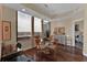 Bright dining room with elegant hardwood floors, expansive windows, and stylish furnishings for elegant dining at 2828 Peachtree Nw Rd # 1402, Atlanta, GA 30305