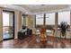 Bright dining room featuring hardwood floors, large windows with city views, and a dining table set at 2828 Peachtree Nw Rd # 1402, Atlanta, GA 30305