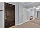 Hallway featuring unit 1402, with soft lighting and a glimpse of comfortable seating ahead at 2828 Peachtree Nw Rd # 1402, Atlanta, GA 30305