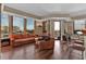 Spacious living room with hardwood floors, city views, and a balcony at 2828 Peachtree Nw Rd # 1402, Atlanta, GA 30305