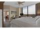 Bright main bedroom featuring expansive windows, ceiling fan, and neutral decor at 2828 Peachtree Nw Rd # 1402, Atlanta, GA 30305