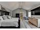 Spacious main bedroom features vaulted ceiling, wood floors, and TV above a dresser at 627 Rock Springs Rd, Lawrenceville, GA 30043