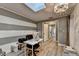 Bright office with skylight, gray striped accent wall, and chandelier at 627 Rock Springs Rd, Lawrenceville, GA 30043