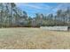 Expansive backyard with trees, white fence, and shed providing a private, peaceful outdoor space at 637 Rock Springs Rd, Lawrenceville, GA 30043