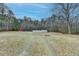 Spacious backyard surrounded by trees and a white fence, providing ample outdoor space at 637 Rock Springs Rd, Lawrenceville, GA 30043