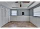 Bedroom with light blue walls, closet, and wood floors at 637 Rock Springs Rd, Lawrenceville, GA 30043