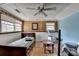 Bedroom with a wooden ceiling, wood paneling, and light blue walls at 637 Rock Springs Rd, Lawrenceville, GA 30043
