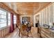 Cozy dining room featuring wood paneling, hardwood floors, and vintage furnishings at 637 Rock Springs Rd, Lawrenceville, GA 30043