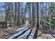 Paved driveway winding through trees, providing a scenic entrance to the property at 637 Rock Springs Rd, Lawrenceville, GA 30043