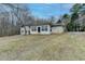 View of house exterior with a walkout basement on a quiet, wooded lot at 637 Rock Springs Rd, Lawrenceville, GA 30043