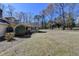 Property with expansive yard, lush lawn and mature trees, offering natural beauty at 637 Rock Springs Rd, Lawrenceville, GA 30043