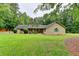 Charming home featuring a well-maintained lawn, mature trees and a welcoming front porch at 637 Rock Springs Rd, Lawrenceville, GA 30043