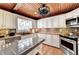 Well-lit kitchen featuring stainless steel appliances, white cabinetry and butcher block island with tile top at 637 Rock Springs Rd, Lawrenceville, GA 30043