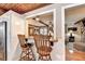 Eat-in bar area connecting the living room and kitchen with hardwood ceiling and marble countertops at 637 Rock Springs Rd, Lawrenceville, GA 30043