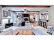 Cozy living room featuring hardwood floors, fireplace, beamed ceilings and ample seating at 637 Rock Springs Rd, Lawrenceville, GA 30043