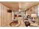 Inviting living room with wood paneling, brick fireplace, and comfortable seating at 637 Rock Springs Rd, Lawrenceville, GA 30043