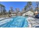 Backyard swimming pool with ample space for tables and chairs; perfect for outdoor entertaining at 637 Rock Springs Rd, Lawrenceville, GA 30043