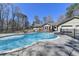 Backyard swimming pool with ample space for tables and chairs; perfect for outdoor entertaining at 637 Rock Springs Rd, Lawrenceville, GA 30043