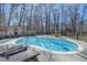 Large swimming pool area with lounge chairs and a wooded backdrop providing great privacy at 637 Rock Springs Rd, Lawrenceville, GA 30043