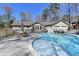 Backyard swimming pool with ample space for tables and chairs; perfect for outdoor entertaining at 637 Rock Springs Rd, Lawrenceville, GA 30043