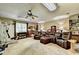 Spacious recreation room with home gym, theater seating, and a ceiling fan at 637 Rock Springs Rd, Lawrenceville, GA 30043