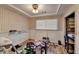 Versatile room with built-in shelving, wood floors, and ample space at 637 Rock Springs Rd, Lawrenceville, GA 30043