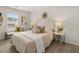 Cozy bedroom featuring natural light, a stylish bed and neutral decor at 9472 Cedar Grove Ct # 237, Jonesboro, GA 30238
