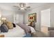 Bright primary bedroom featuring a large bed, accent wall art, and neutral decor at 9472 Cedar Grove Ct # 237, Jonesboro, GA 30238