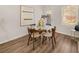 Cozy dining area with round glass table, wood chairs, and natural light at 9472 Cedar Grove Ct # 237, Jonesboro, GA 30238