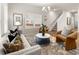 Cozy living room with neutral colors, comfortable seating, and a view of the stairs at 9472 Cedar Grove Ct # 237, Jonesboro, GA 30238