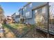 A spacious backyard offers a wooden deck with curtains, a trampoline, play-set, and plenty of room to play at 4526 Balto Way, Acworth, GA 30101