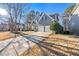 Beautiful home with a two-car garage, complemented by a well-manicured lawn and mature trees in a neighborhood at 4526 Balto Way, Acworth, GA 30101