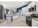 Stylish kitchen featuring granite countertops, white cabinets, stainless steel appliances, and subway tile backsplash at 4526 Balto Way, Acworth, GA 30101