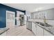 Bright kitchen with stainless steel appliances, granite countertops and a view to the breakfast nook area at 4526 Balto Way, Acworth, GA 30101