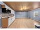 Functional kitchenette features new cabinets, tile backsplash, and modern microwave at 4526 Balto Way, Acworth, GA 30101