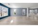 Spacious living room filled with natural light, showcasing hardwood floors and neutral gray walls at 4526 Balto Way, Acworth, GA 30101