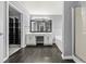 A full main bathroom featuring a double vanity, soaker tub, walk-in shower, and organized walk-in closet at 4526 Balto Way, Acworth, GA 30101