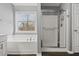 A main bathroom offering a soaking tub with chrome fixtures and a glass-enclosed shower with modern tiling at 4526 Balto Way, Acworth, GA 30101