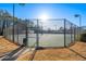 Outdoor tennis courts with lighting and fencing, providing a secure and well-lit recreational area for residents at 4526 Balto Way, Acworth, GA 30101
