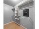 Spacious walk-in closet with custom shelving and built-in safe at 4526 Balto Way, Acworth, GA 30101