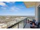 Balcony with outdoor seating and views of the city skyline and surrounding green spaces at 4561 Olde Perimeter Way # 2609, Atlanta, GA 30346