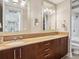 Modern bathroom featuring double sinks, a marble countertop, dark wood cabinets, and modern fixtures at 4561 Olde Perimeter Way # 2609, Atlanta, GA 30346