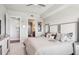 Neutral bedroom featuring a walk-in closet, attached bathroom, and modern ceiling fan at 4561 Olde Perimeter Way # 2609, Atlanta, GA 30346