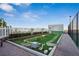 Charming dog park area with turf and decorative landscaping at 4561 Olde Perimeter Way # 2609, Atlanta, GA 30346