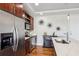 Modern kitchen featuring stainless steel appliances, a center island with a sink, and sleek countertops at 4561 Olde Perimeter Way # 2609, Atlanta, GA 30346