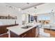 Stylish kitchen showcasing wood cabinets, quartz counters, stainless appliances and connecting Living Room at 4561 Olde Perimeter Way # 2609, Atlanta, GA 30346