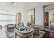 Cozy lobby area with stylish armchairs and a large mirror at 4561 Olde Perimeter Way # 2609, Atlanta, GA 30346