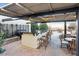Outdoor kitchen with bar-style seating and dining area, perfect for grilling and entertaining at 4561 Olde Perimeter Way # 2609, Atlanta, GA 30346