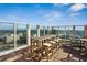 Stunning rooftop patio with glass railings and panoramic city views, perfect for entertaining or relaxing at 4561 Olde Perimeter Way # 2609, Atlanta, GA 30346